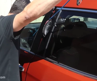 A professional technician working on car locksmth